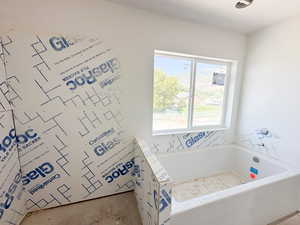 Full bathroom with a garden tub