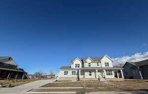 View of front of house featuring covered porch and a residential view