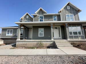 View of front of house with a porch and board and batten siding
