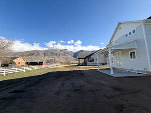 View of yard featuring a mountain view and a patio area