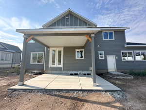 Rear view of property with a patio