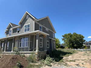 View of front of property with board and batten siding