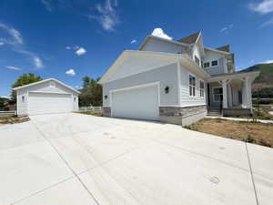 Light blue siding exterior with stone accents and a covered front porch