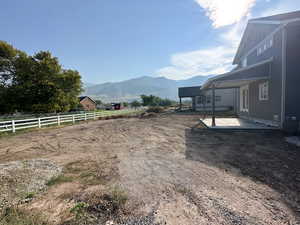 View of yard featuring a mountain view and a patio area