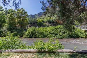 View of yard with a water view