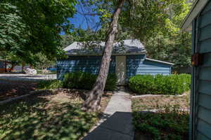 View of home's exterior featuring roof with shingles
