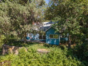 View of property hidden behind natural elements