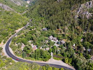 Aerial view of property's location with a heavily wooded area