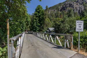 View of road featuring a wooded view
