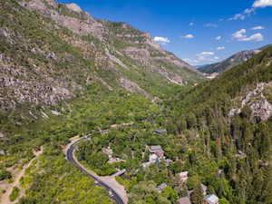 View of mountain backdrop featuring a heavily wooded area