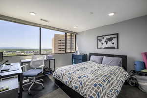 Carpeted bedroom featuring a desk and recessed lighting
