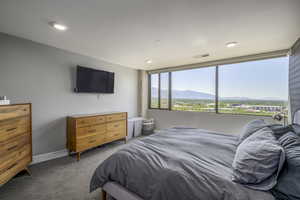 Carpeted bedroom featuring baseboards and recessed lighting