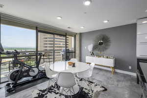 Dining area with healthy amount of natural light, floor to ceiling windows, and recessed lighting