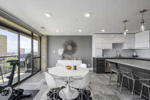 Dining room with expansive windows and recessed lighting