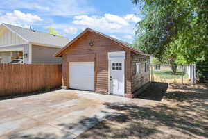 Garage featuring concrete driveway