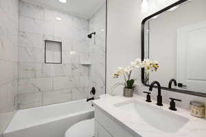 Bathroom with bathtub / shower combination and vanity