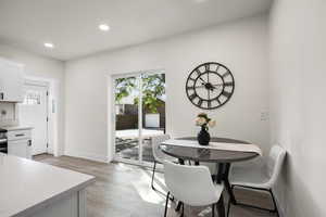 Dining space featuring recessed lighting and light wood-type flooring