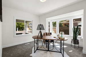 Carpeted home office with baseboards