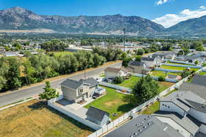 Aerial view of residential area featuring a mountainous background