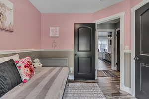Bedroom with wood finished floors