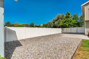 Fenced backyard with a patio