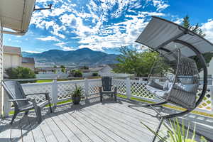 Wooden deck featuring a mountain view