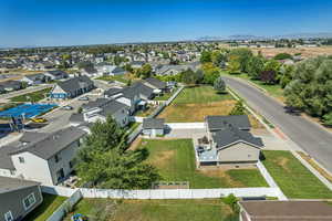 Aerial perspective of suburban area featuring a mountainous background