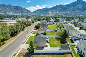 Aerial perspective of suburban area featuring a mountain backdrop