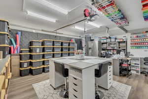 Home office with light wood-style floors