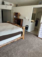 Tiled bedroom with carpet floors