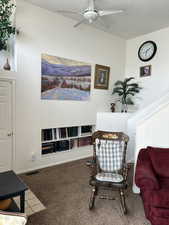 Sitting room with carpet floors and a ceiling fan