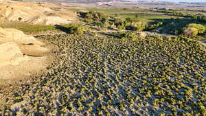 Aerial view of property and surrounding area featuring rural landscape
