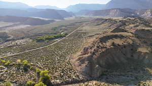 View of mountain backdrop featuring rural landscape