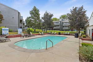 Community pool featuring a patio