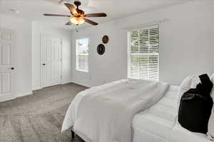 Bedroom with carpet flooring and ceiling fan