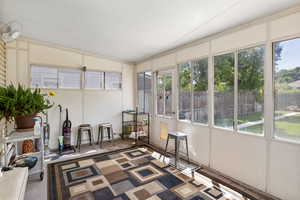 Sunroom / solarium with vaulted ceiling