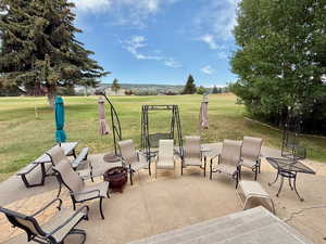 View of patio featuring an outdoor fire pit
