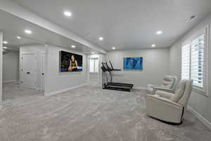 Living area featuring carpet flooring and recessed lighting