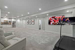 Living room featuring recessed lighting and light colored carpet
