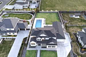 Aerial view of residential area featuring a pool