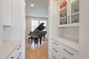 Sitting room featuring light wood-style flooring and recessed lighting