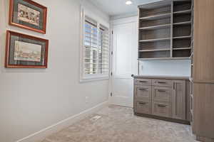 Unfurnished office with light carpet and recessed lighting