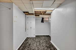 Basement featuring baseboards