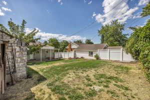 Fenced backyard with a patio