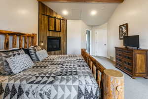 Bedroom featuring carpet floors and baseboards