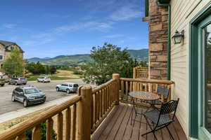 Wooden deck featuring a mountain view