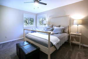 Bedroom with carpet floors and a ceiling fan