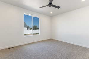 Unfurnished room featuring carpet flooring, ceiling fan, and recessed lighting