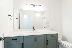 Bathroom with vanity and toilet