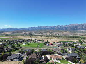 Aerial view of residential area with a mountainous background